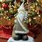 18.5" Brown & White Santa Holding Christmas Tree Tabletop Figurine